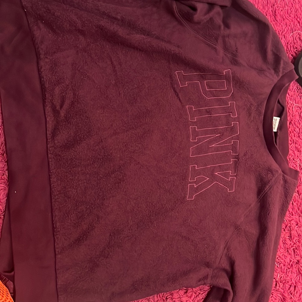 It’s a pink crew neck sweater vintage